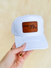 Drinks Well With Others Trucker Hat